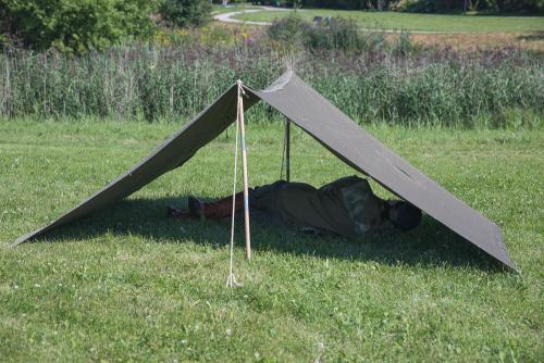 NVA Tent Stake and Pole Set, 30 Piece Set, Surplus. A display of the simplest tent.